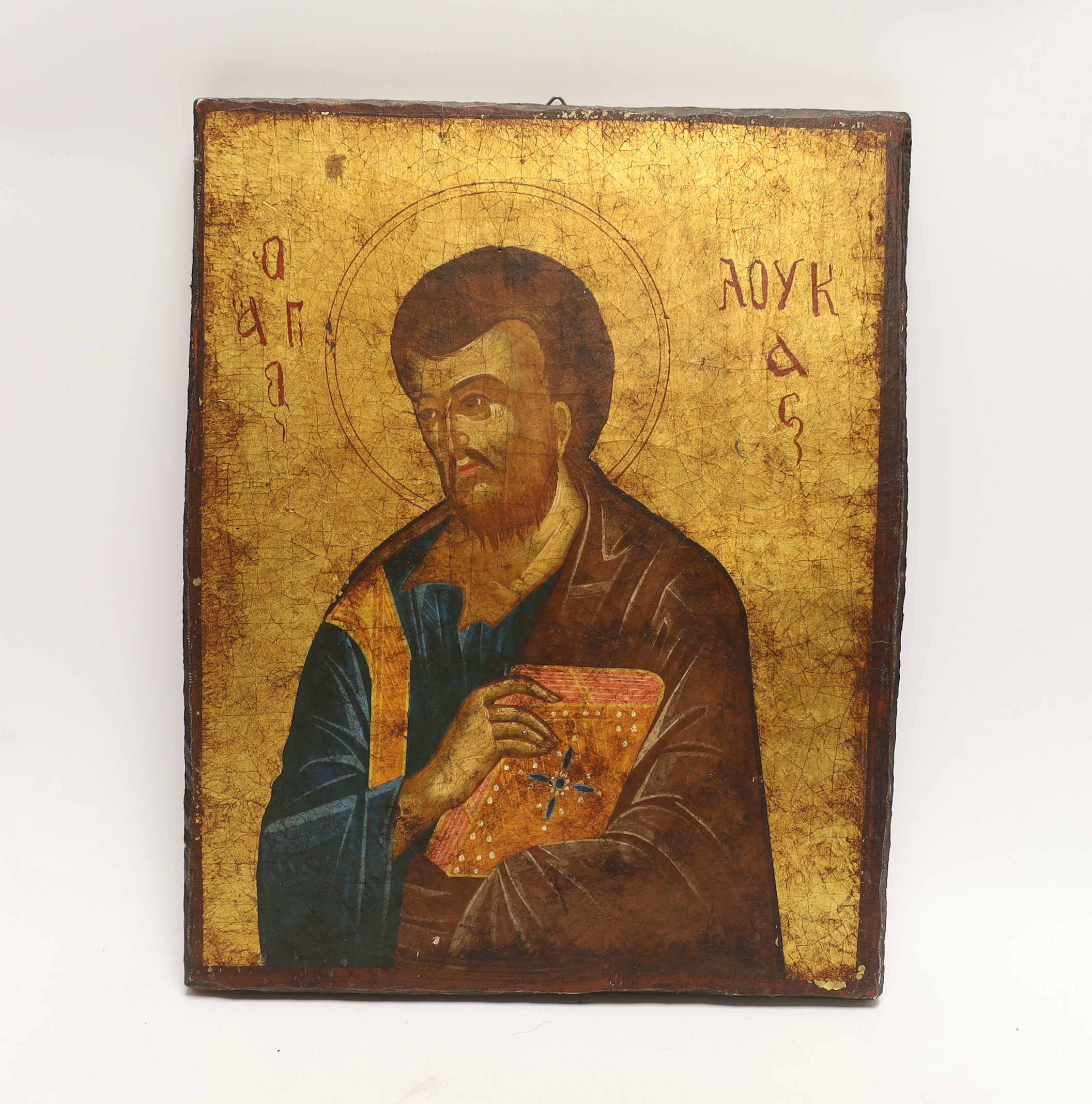 A 19th century Russian Icon, Luke the Evangelist, 23cm wide x 29cm high